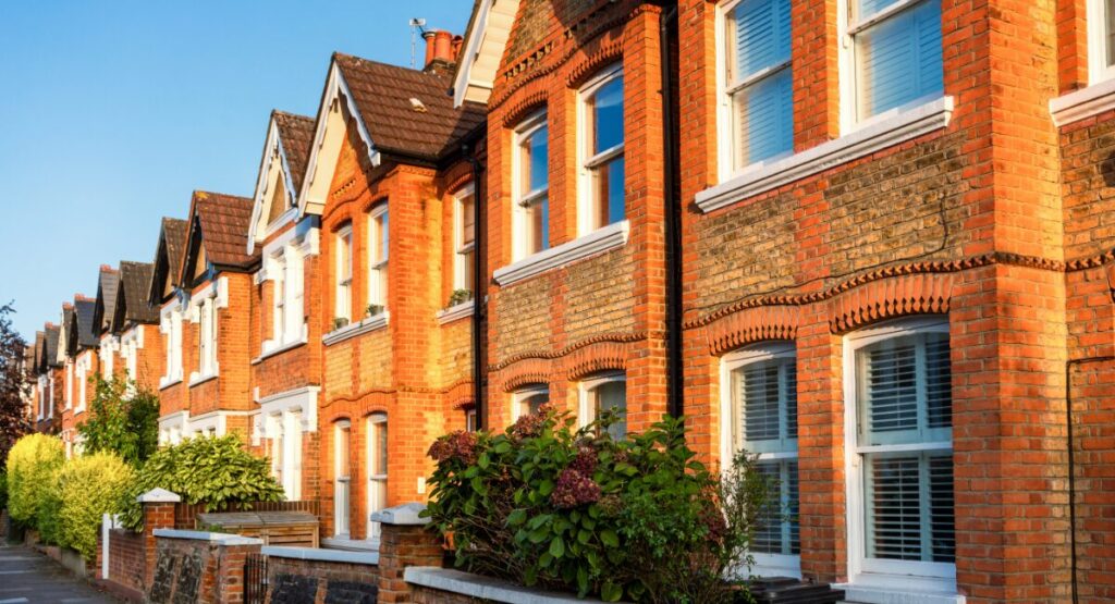 Traditional UK terraced houses with red brick exteriors