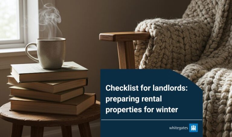 Stack of books with a steaming mug beside a cozy knitted blanket on a chair, illustrating Whitegates’ checklist for landlords on preparing rental properties for winter.