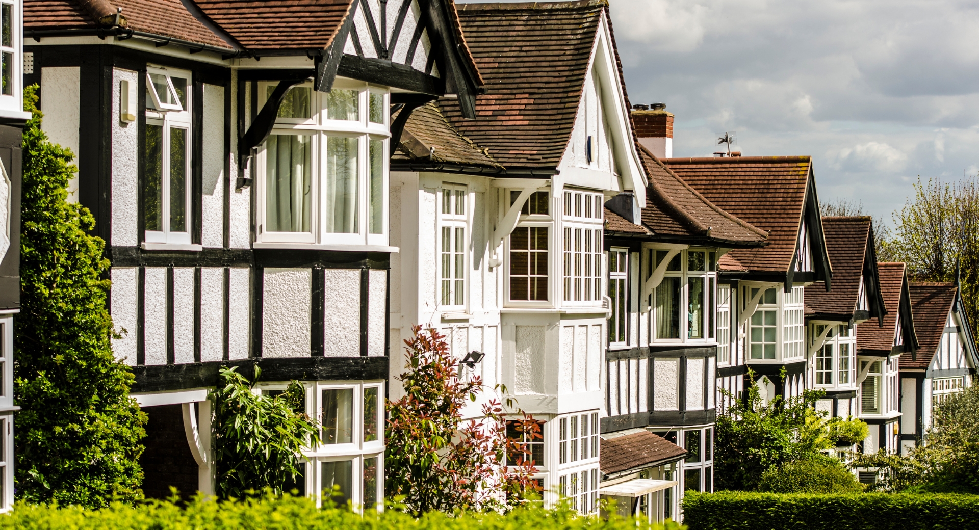 Row of traditional UK houses in a local neighbourhood, highlighting the value of local estate agent expertise
