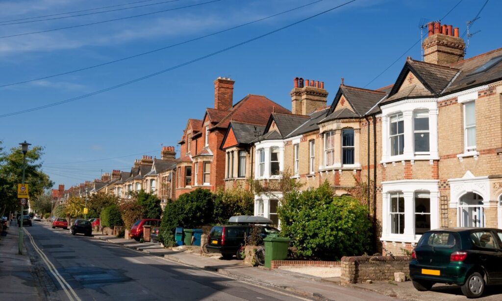 Row of traditional terraced and semi-detached houses on a residential street in Castleford, West Yorkshire.