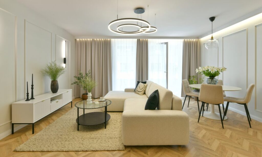 Contemporary open-plan living and dining room with modern décor, neutral tones and natural light.