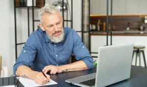 Landlord analysing rental income figures and planning cashflow under Section 13 once-per-year rent increase rules