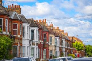Row of red-brick terraced houses on a residential street in Bootle