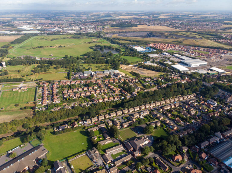 Drone view of Pontefract neighbourhoods, green spaces and residential housing in West Yorkshire