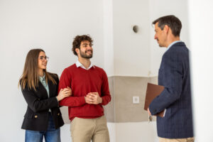 Young couple speaking with letting agent during a rental property viewing in Sefton