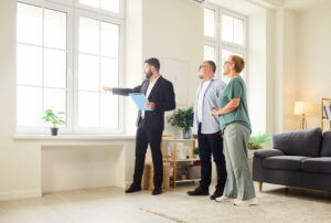 Letting agent showing a rental property to landlords during a property management consultation in Woolton.