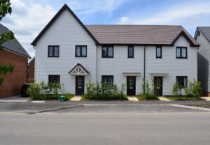 Modern white terraced houses in a newly built UK neighbourhood