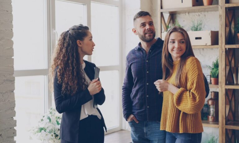 Estate agent showing a property to prospective buyers in Featherstone WF7