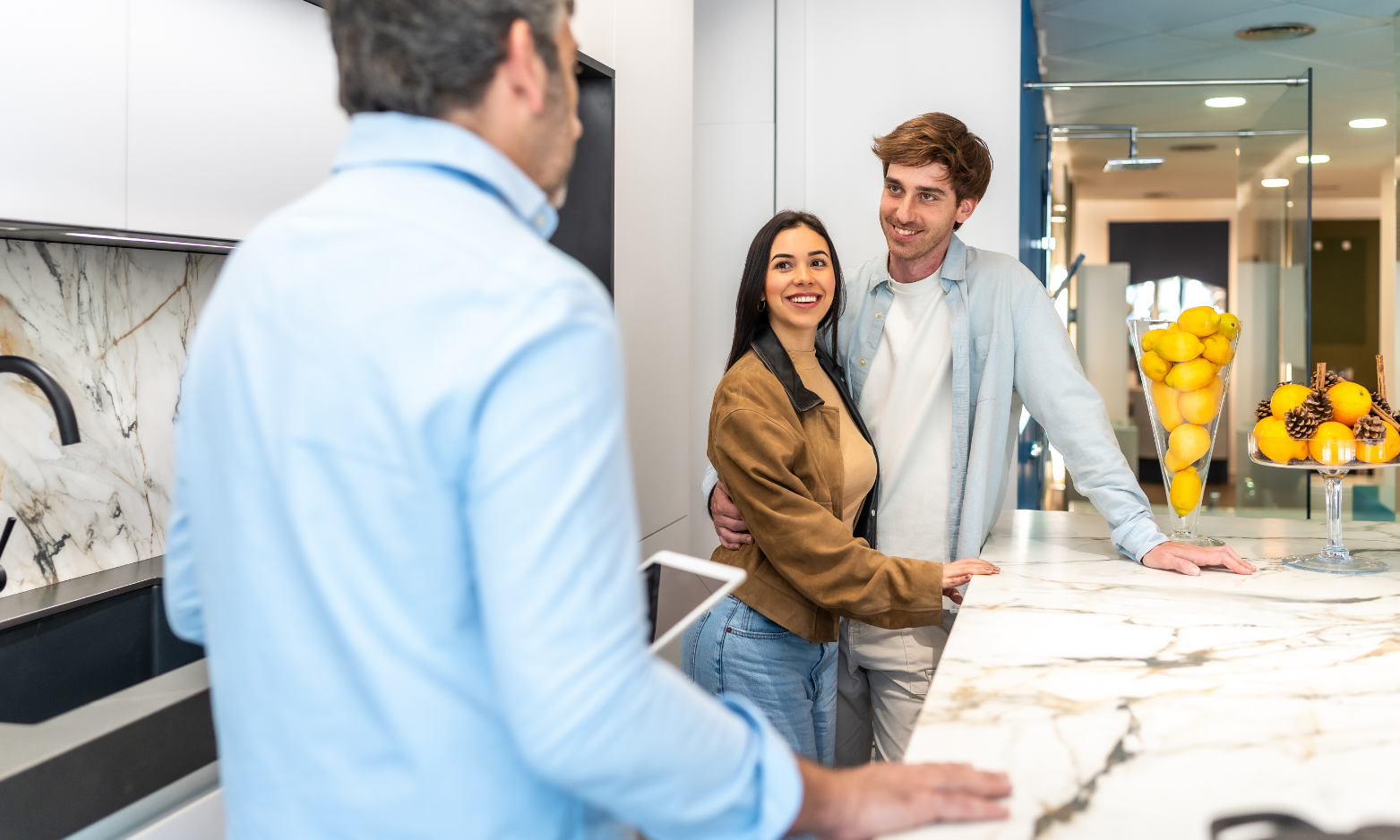Couple speaking with an estate agent while viewing a modern home in West Derby.