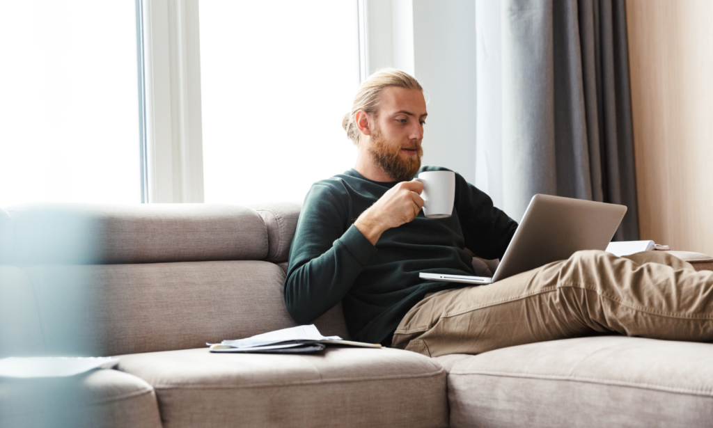 Homeowner using a laptop while researching bungalow and downsizing options in Pontefract.