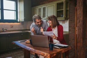 Couple calculating their budget and the costs of buying a first home in Pontefract, WF8