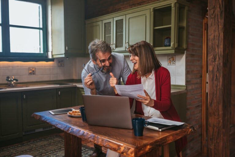 Couple calculating their budget and the costs of buying a first home in Pontefract, WF8